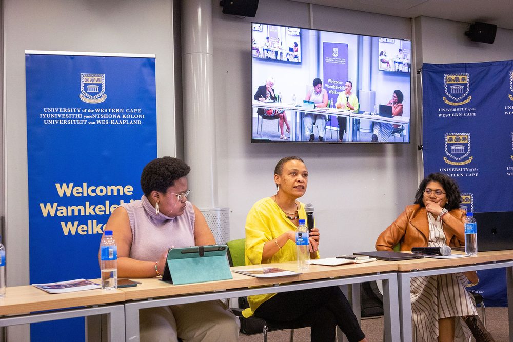 The seminar panel with online participants shown on screen